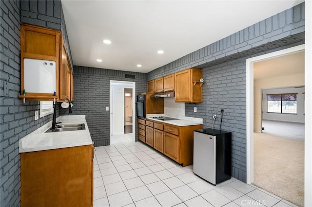 26409 Brandywine Ct, Menifee, CA 92586 - kitchen with black appliances, light tile patterned floors, light countertops, under cabinet range hood, and recessed lighting