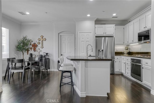 3393 Shadetree Way, Camarillo, CA 93012 - kitchen featuring stainless steel appliances, dark wood finished floors, white cabinets, ornamental molding, and recessed lighting