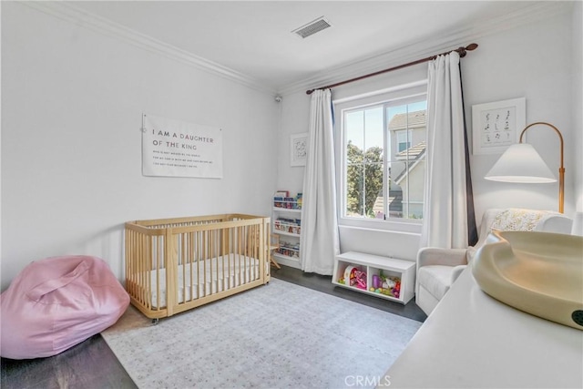 3393 Shadetree Way, Camarillo, CA 93012 - bedroom with ornamental molding, wood finished floors, and a crib