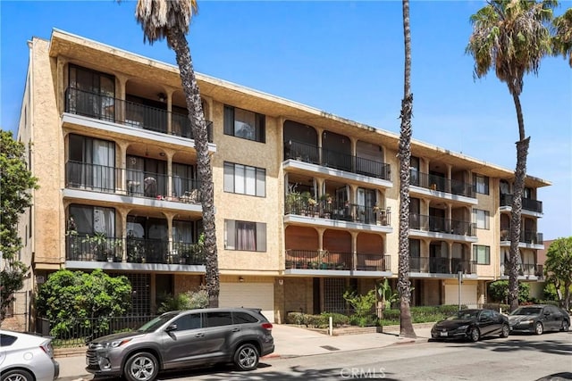 3511 Elm Ave Unit 212, Long Beach, CA 90807 - view of apartment building / complex featuring a garage