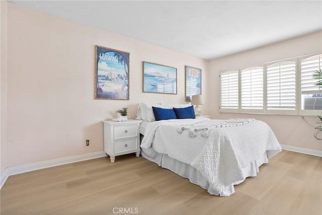 3511 Elm Ave Unit 212, Long Beach, CA 90807 - bedroom with light wood finished floors and cooling unit