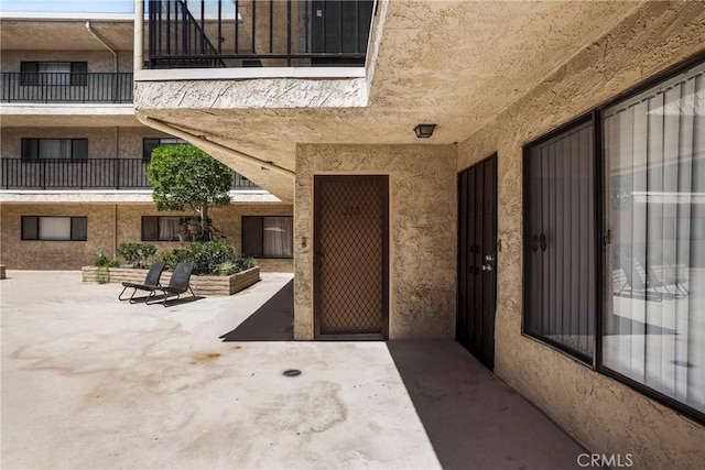 3511 Elm Ave Unit 212, Long Beach, CA 90807 - property entrance with a patio and stucco siding