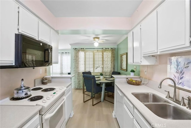 3511 Elm Ave Unit 212, Long Beach, CA 90807 - kitchen with white appliances, white cabinets, light countertops, light wood-type flooring, and ornamental molding