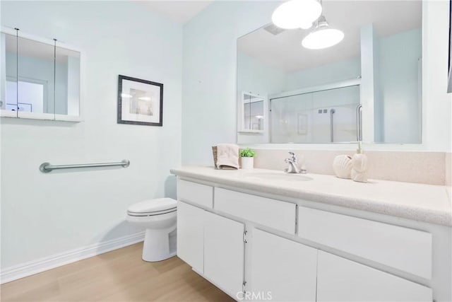3511 Elm Ave Unit 212, Long Beach, CA 90807 - full bath with wood finished floors, a shower stall, and vanity
