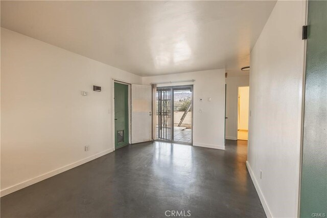 72011 Two Mile Rd Unit 29, Palms, CA 92277 - spare room featuring baseboards and concrete flooring