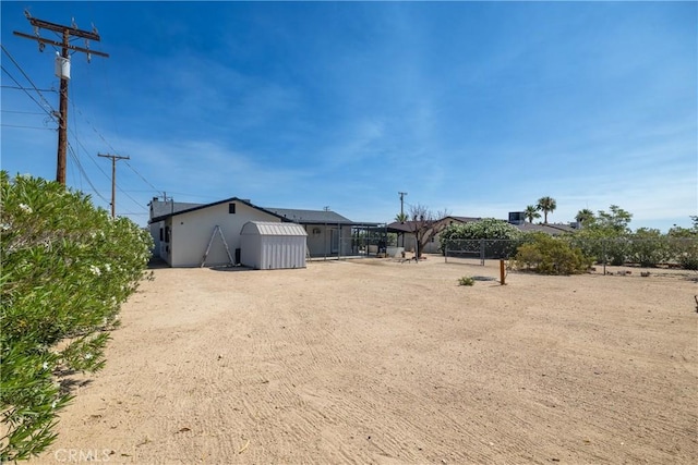 72011 Two Mile Rd Unit 29, Palms, CA 92277 - view of yard featuring a storage shed