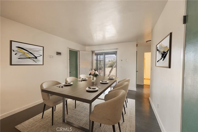 72011 Two Mile Rd Unit 29, Palms, CA 92277 - dining room with baseboards and dark wood-type flooring