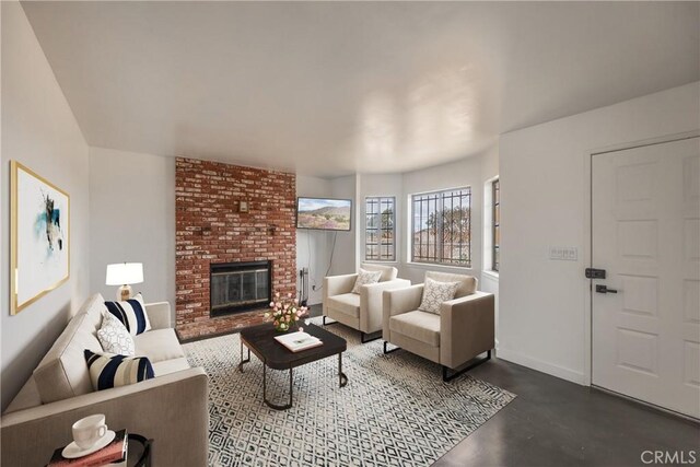 72011 Two Mile Rd Unit 29, Palms, CA 92277 - living room with a brick fireplace and concrete floors