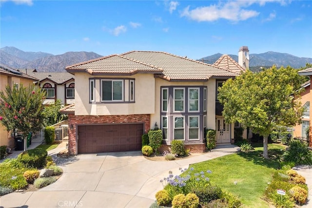 826 Country Oaks Ln, Arcadia, CA 91006 - mediterranean / spanish-style home featuring stucco siding, a mountain view, concrete driveway, and a garage