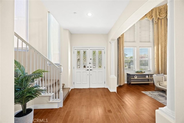 826 Country Oaks Ln, Arcadia, CA 91006 - foyer with stairs, wood-type flooring, and decorative columns
