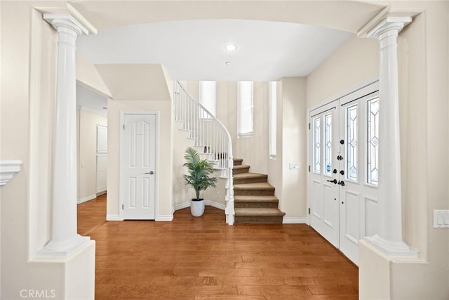 826 Country Oaks Ln, Arcadia, CA 91006 - foyer entrance with light wood finished floors, stairs, and decorative columns