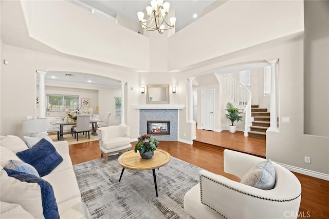 826 Country Oaks Ln, Arcadia, CA 91006 - living room with ornate columns, wood finished floors, and stairs