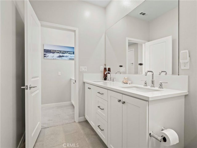 27717 Knoll View Pl, Valencia, CA 91381 - full bathroom featuring double vanity and baseboards