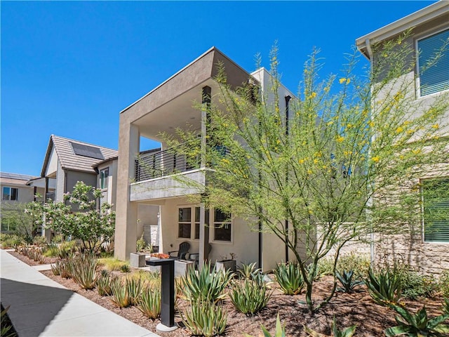 27717 Knoll View Pl, Valencia, CA 91381 - view of front of home with stucco siding and a balcony