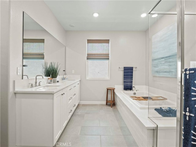 27717 Knoll View Pl, Valencia, CA 91381 - bathroom with double vanity, a bath, tile patterned flooring, and recessed lighting