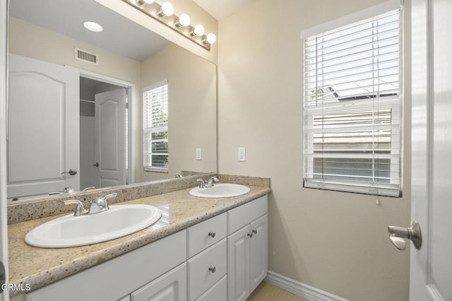 724 Parrish St, Ventura, CA 93003 - bathroom featuring double vanity and baseboards