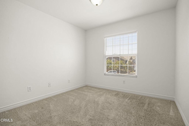 724 Parrish St, Ventura, CA 93003 - carpeted empty room featuring baseboards