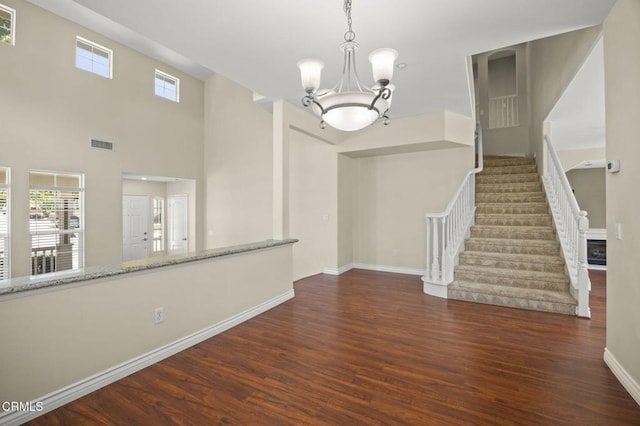 724 Parrish St, Ventura, CA 93003 - interior space with wood finished floors, stairway, and a chandelier