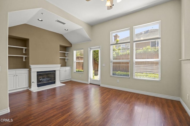 724 Parrish St, Ventura, CA 93003 - unfurnished living room with vaulted ceiling, a glass covered fireplace, wood finished floors, built in features, and ceiling fan