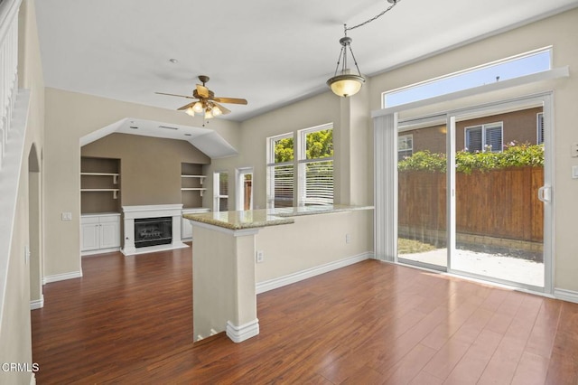 724 Parrish St, Ventura, CA 93003 - kitchen featuring a ceiling fan, dark wood finished floors, a peninsula, and built in features