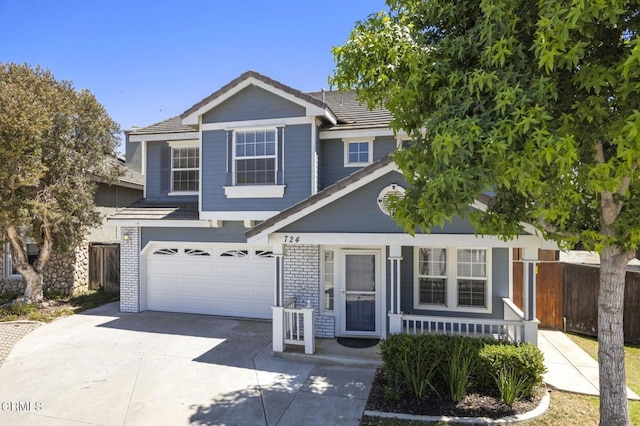 724 Parrish St, Ventura, CA 93003 - traditional-style house with an attached garage, concrete driveway, a porch, and brick siding