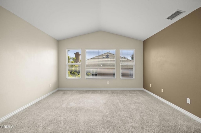 724 Parrish St, Ventura, CA 93003 - carpeted spare room with vaulted ceiling and baseboards