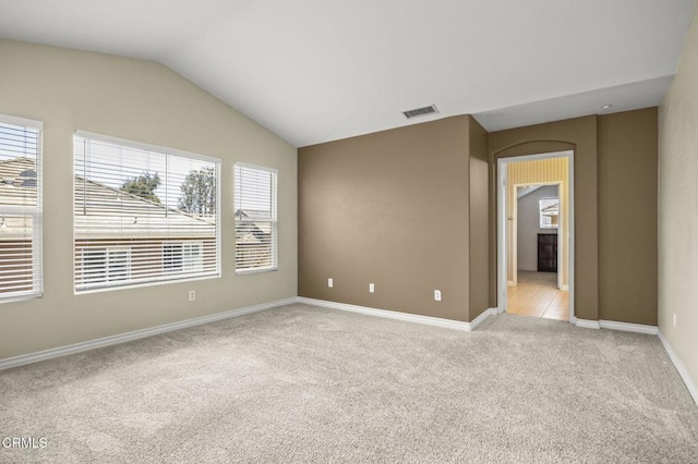724 Parrish St, Ventura, CA 93003 - unfurnished room featuring light carpet and lofted ceiling