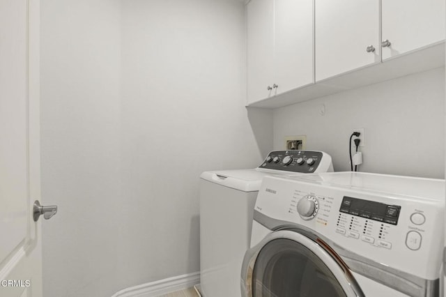 724 Parrish St, Ventura, CA 93003 - laundry area featuring separate washer and dryer and cabinet space