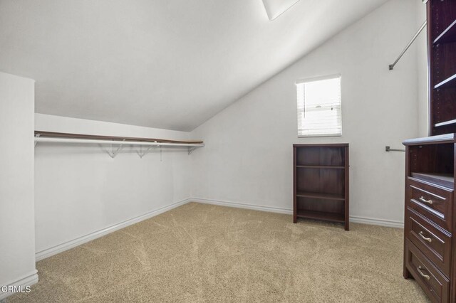 724 Parrish St, Ventura, CA 93003 - walk in closet with light colored carpet and vaulted ceiling