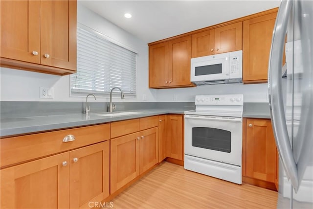 22913 Nadine Cir Unit A, Torrance, CA 90505 - kitchen featuring white appliances, light wood finished floors, brown cabinetry, and recessed lighting