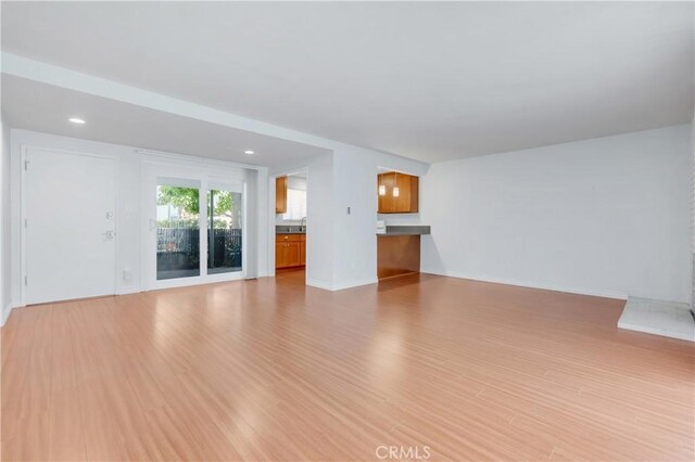 22913 Nadine Cir Unit A, Torrance, CA 90505 - unfurnished living room featuring light wood-style floors and recessed lighting