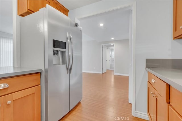 22913 Nadine Cir Unit A, Torrance, CA 90505 - kitchen featuring stainless steel fridge, light countertops, light wood finished floors, and recessed lighting