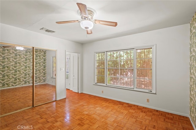 733 W 24th St, San Bernardino, CA 92405 - unfurnished bedroom featuring two closets and ceiling fan