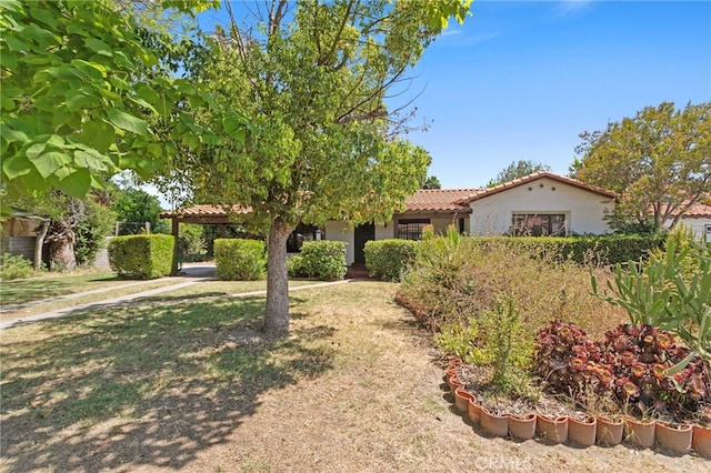 733 W 24th St, San Bernardino, CA 92405 - view of front facade with a tile roof and stucco siding