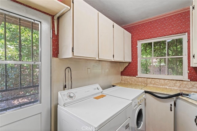 733 W 24th St, San Bernardino, CA 92405 - laundry room with washer and dryer, cabinet space, and wallpapered walls