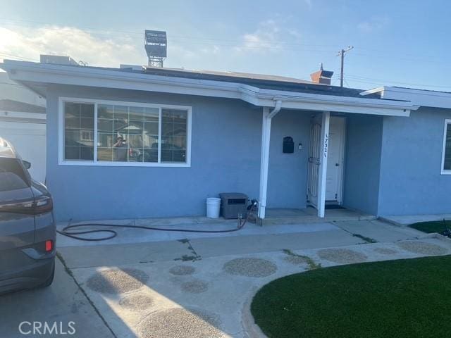 17321 Merit Ave, Gardena, CA 90247 - rear view of property featuring stucco siding and a patio area