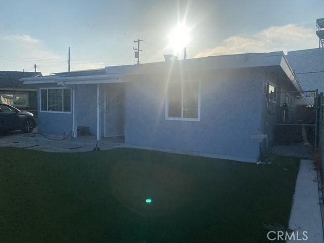17321 Merit Ave, Gardena, CA 90247 - view of front of house featuring stucco siding and a front lawn
