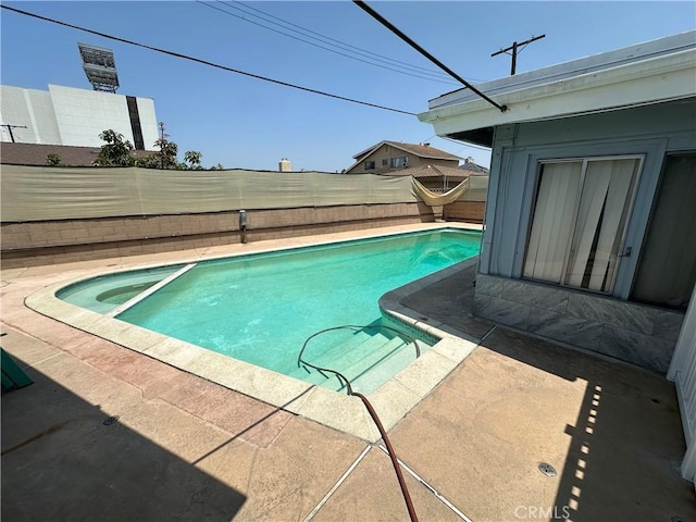 17321 Merit Ave, Gardena, CA 90247 - view of swimming pool featuring a fenced backyard, a pool with connected hot tub, and a patio