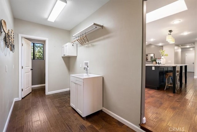 553 Well Rd, Templeton, CA 93465 - washroom featuring washer hookup, dark wood-style floors, cabinet space, and recessed lighting