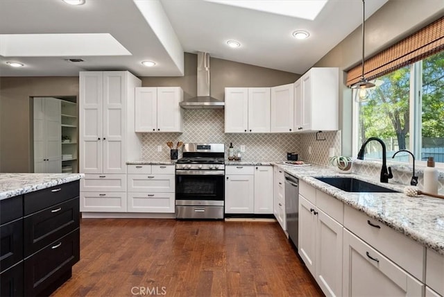 553 Well Rd, Templeton, CA 93465 - kitchen featuring stainless steel appliances, wall chimney exhaust hood, white cabinetry, dark wood-type flooring, and backsplash