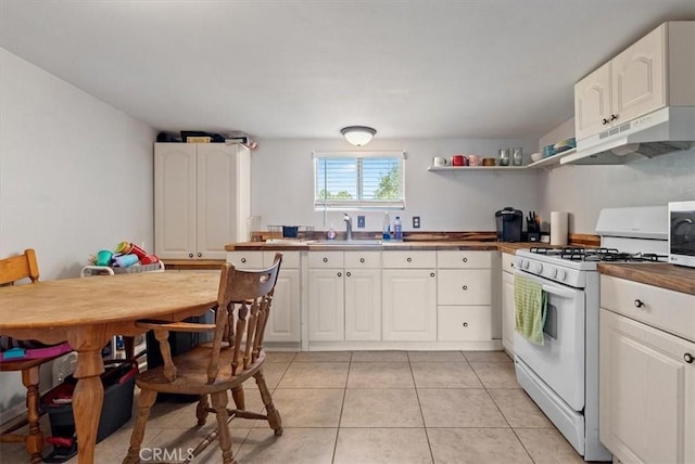 553 Well Rd, Templeton, CA 93465 - kitchen with white range with gas stovetop, under cabinet range hood, white cabinetry, and stainless steel microwave
