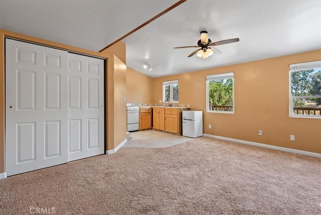 553 Well Rd, Templeton, CA 93465 - unfurnished living room with a ceiling fan, light carpet, and healthy amount of natural light
