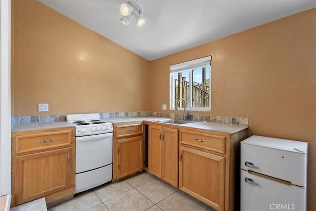 553 Well Rd, Templeton, CA 93465 - kitchen featuring white range with electric cooktop, lofted ceiling, tile counters, and light tile patterned flooring