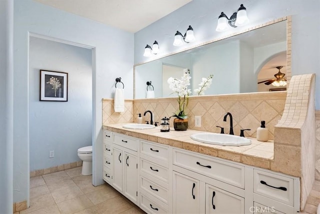 553 Well Rd, Templeton, CA 93465 - bathroom featuring double vanity, backsplash, a ceiling fan, and tile patterned floors