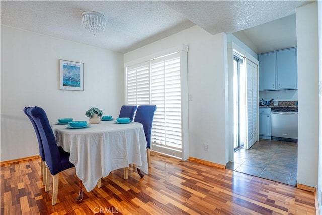 9620 Sepulveda Blvd Unit 4, North Hills, CA 91343 - dining area with light wood finished floors and a textured ceiling