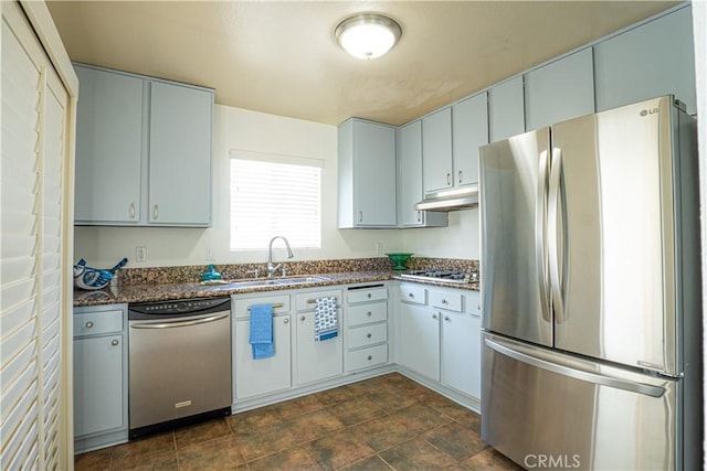 9620 Sepulveda Blvd Unit 4, North Hills, CA 91343 - kitchen featuring stainless steel appliances, under cabinet range hood, stone finish flooring, and dark stone counters