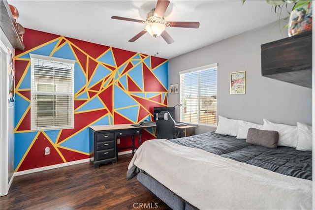 43145 62nd St W, Lancaster, CA 93536 - bedroom with wood finished floors, an accent wall, wallpapered walls, and a ceiling fan