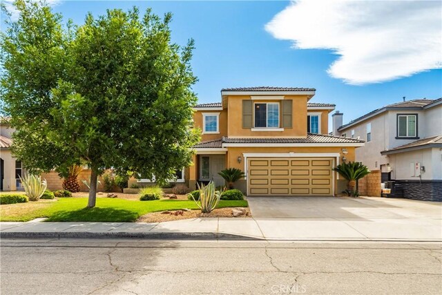 43145 62nd St W, Lancaster, CA 93536 - view of front of property with a tiled roof, concrete driveway, stucco siding, a garage, and a front yard