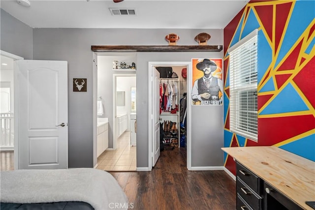 43145 62nd St W, Lancaster, CA 93536 - bedroom with a walk in closet, wood finished floors, and ensuite bathroom