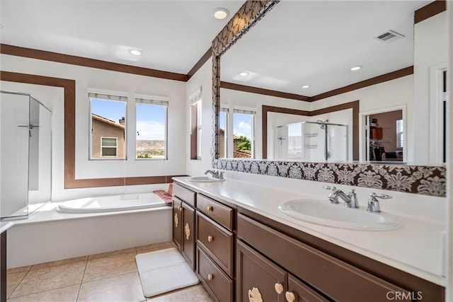 43145 62nd St W, Lancaster, CA 93536 - bathroom featuring a stall shower, a bath, double vanity, tile patterned floors, and a spacious closet